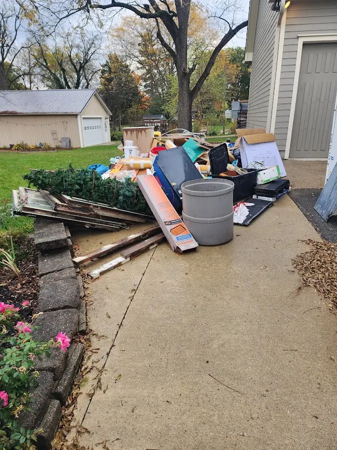 Dumpster being loaded with debris for 30 Yard Dumpster Rental in Galt